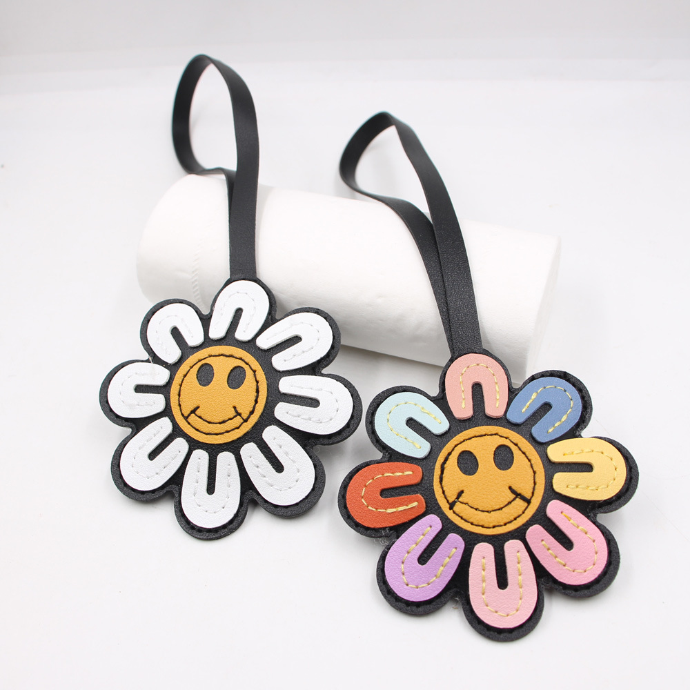 Porte-clés fleur visage joyeux - Phone Accessories Ideas avis et prix